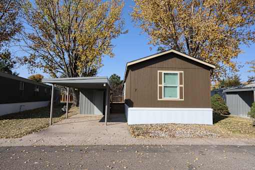 the front of a house with a driveway and a car garage at Circle Park, Cheyenne, 82007