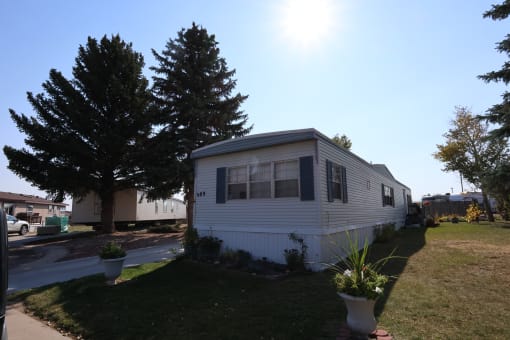 the exterior of a mobile home on the side of a street at Kimberly Village, Cheyenne