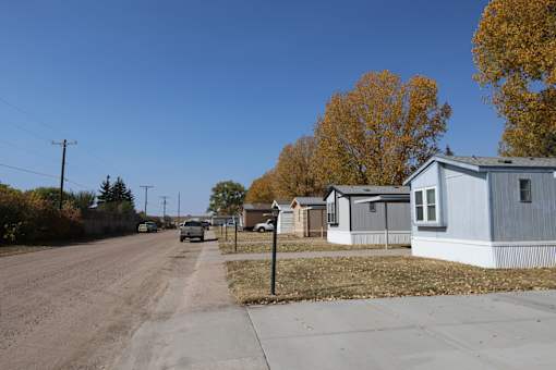 a row of mobile homes on the side of a road at Mobile Home Village, Wyoming