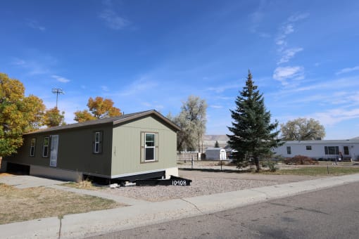 a tiny house on the side of a street at Pioneer Park, Wyoming