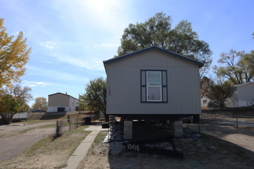 a tiny house on a trailer in the middle of the street at Pioneer Park, Green River, 82935