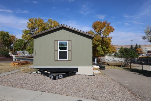 a tiny house on the back of a trailer at Pioneer Park, Wyoming