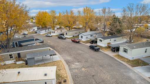 an aerial view of a neighborhood with houses and trees at Circle Park, Wyoming