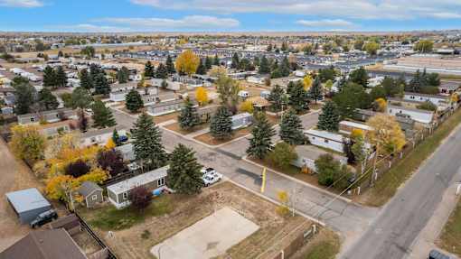 an aerial view of a neighborhood with houses and trees at Kimberly Village, Cheyenne, Wyoming
