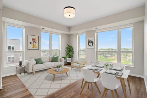 a living room with a couch and a table with chairs