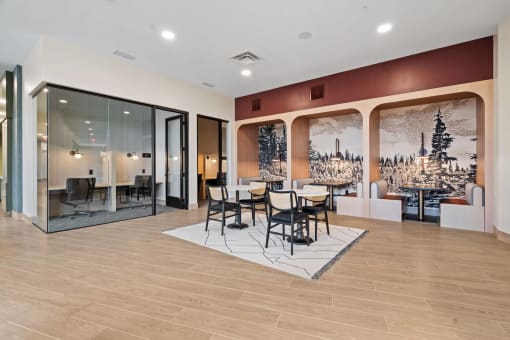 a dining room with a table and chairs and a wall mural