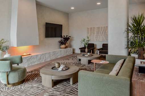 A living room with a green couch and a coffee table.