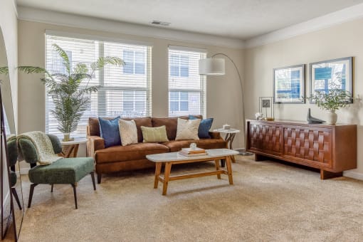Westerville, OH Pet-Friendly Apartments - Kenyon Square - Furnished Living Room with Plush Carpet Flooring, Large Windows, and 9’ Ceilings