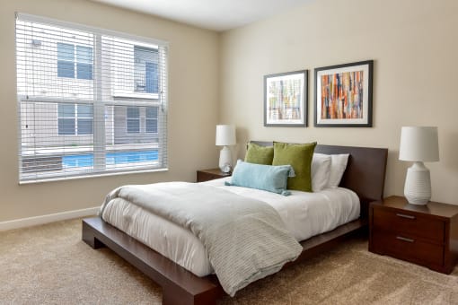 Westerville, OH Apartments Near Target - Kenyon Square - Furnished Bedroom with Plush Carpet Flooring, 9’ Ceiling, and an Oversized Window with Blinds