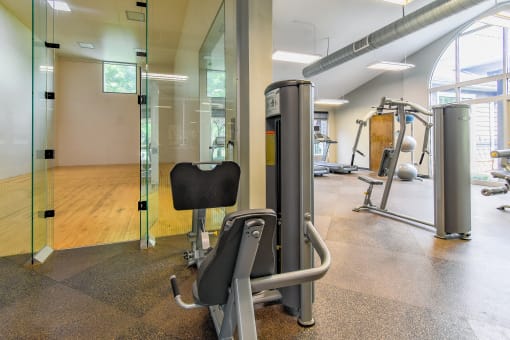 a treadmill and other exercise equipment in the fitness room  at Riverset Apartments, Tennessee