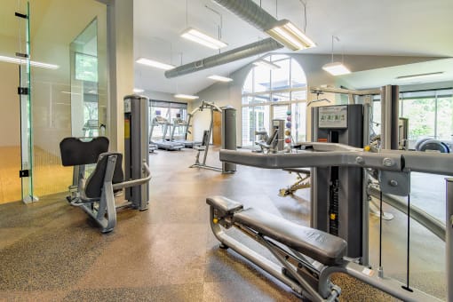 a gym with cardio equipment and weights at Riverset Apartments in Mud Island, Memphis, TN