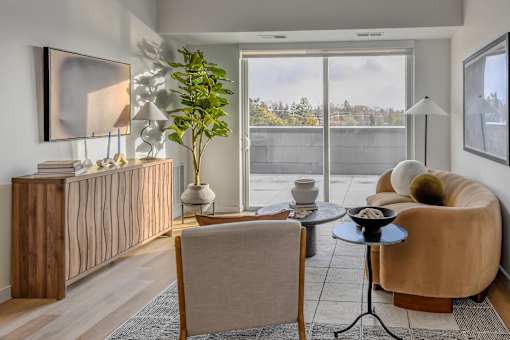 A living room with a brown chair and a small table.