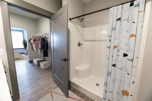 Bathroom with walk-in shower at The Commons at Rivertown, Grandville, 49418