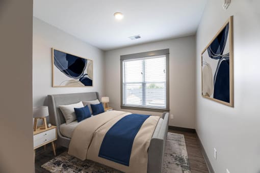 a bedroom with a large bed at The Commons at Rivertown, Grandville