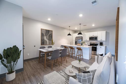 an open living room and kitchen at The Commons at Rivertown, Grandville, MI