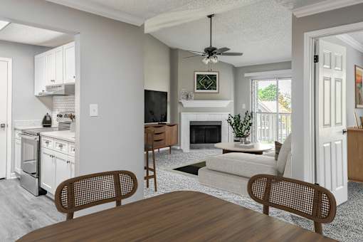 A modern kitchen with a dining table and chairs.