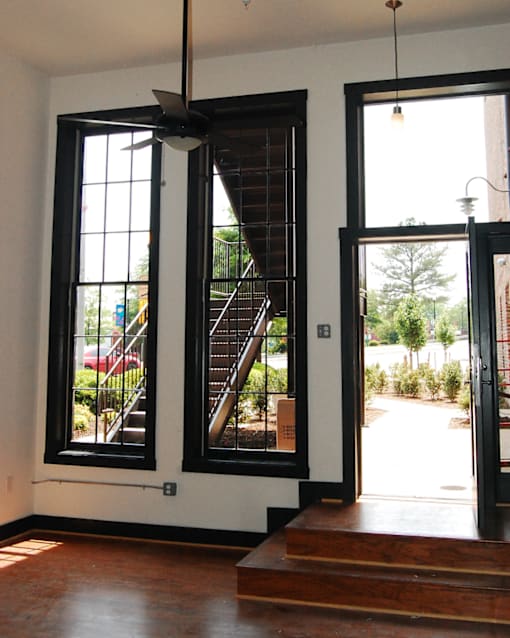 A room with a staircase and a window.