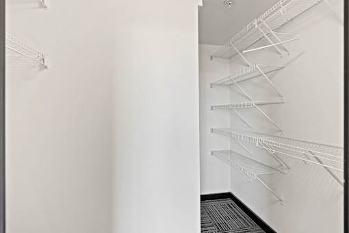 Empty white shelves in a room.