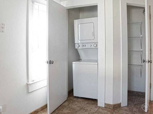 A white oven and dishwasher in a kitchen.
