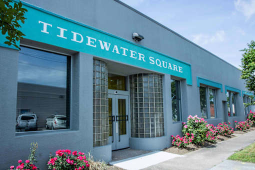 A building with the name Tidewater Square on it.