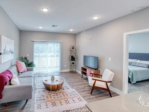 Living room with patio view at Westown at Wilson, Grand Rapids, Michigan