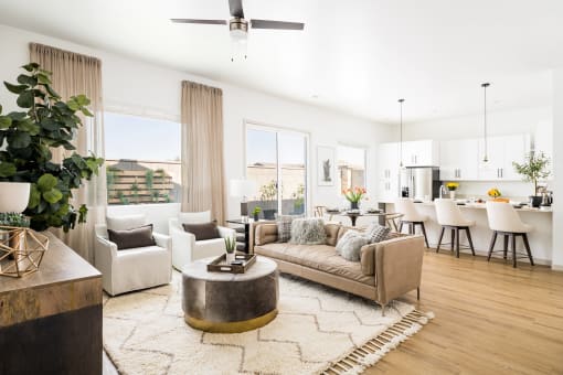 a living room with a couch and a table at Onyx at Westgate Apartments, Glendale, AZ, 85305