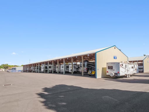 a large building with trucks parked outside of it