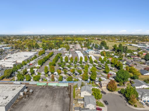 an aerial view of a neighborhood with houses and trees