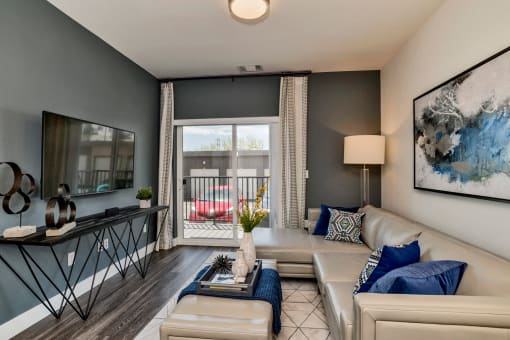 Living Room With TV at West Line Flats Apartments in Lakewood, CO