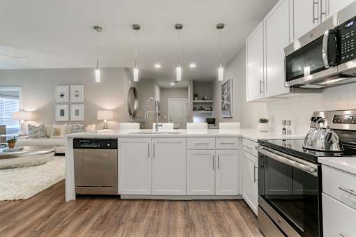 a spacious kitchen with white cabinets and stainless steel appliances at Annandale Apartment Homes, Murfreesboro, 37128