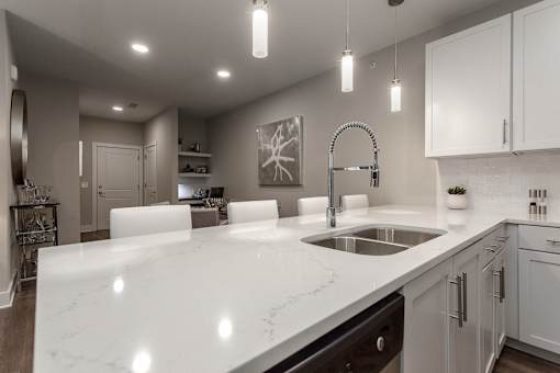 an open kitchen with white counter tops and a sink at Annandale Apartment Homes, Murfreesboro, Tennessee