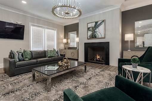 a living room with a fireplace and couches at Annandale Apartment Homes, Murfreesboro, Tennessee