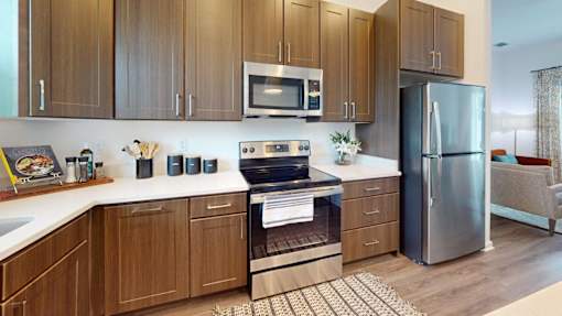 Kitchen with Wooden Cabinets at Artesia at Lakewood Ranch Apartments, Bradenton, Florida