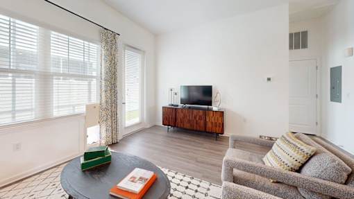 Living Room with a Grey Couch at Artesia at Lakewood Ranch Apartments, Bradenton