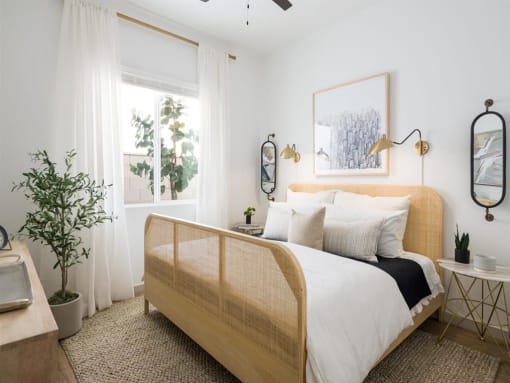 bedroom view with tan bed at Onyx at Westgate Apartments, Glendale
