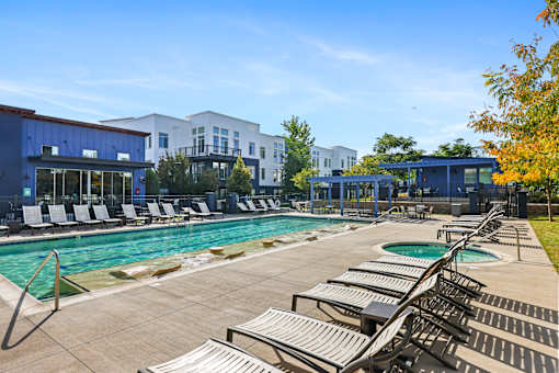 Swimming Pool with Relaxing Area at 8000 Uptown Apartments, Colorado