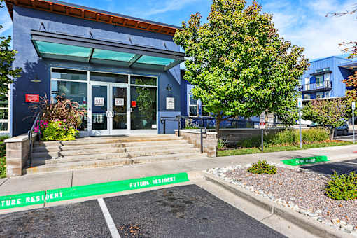 A Blue Building with Glass Door at 8000 Uptown Apartments, Broomfield, CO, 80021