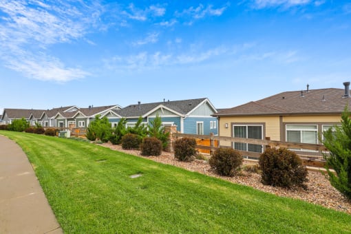a row of houses in a suburban neighborhood at The Villas at Prairie Center, Colorado, 80601
