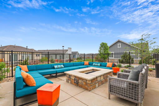 gather around the fire pit at the enclave at woodbridge apartments in sugar land, tx at The Villas at Prairie Center, Colorado