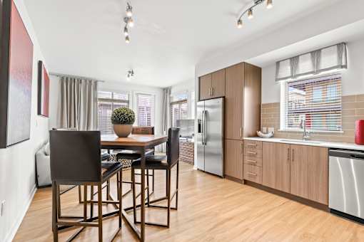 a kitchen and dining area at 8000 Uptown Apartments, Broomfield, Colorado