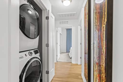a laundry room with a washer and dryer at 8000 Uptown Apartments, Colorado 80021