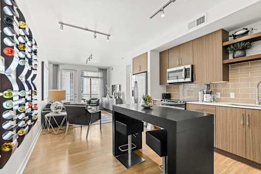 a kitchen and living room at 8000 Uptown Apartments, Broomfield, Colorado