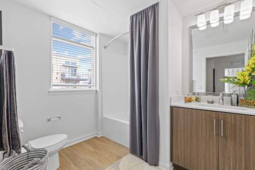 a bathroom with a toilet sink at 8000 Uptown Apartments, Broomfield