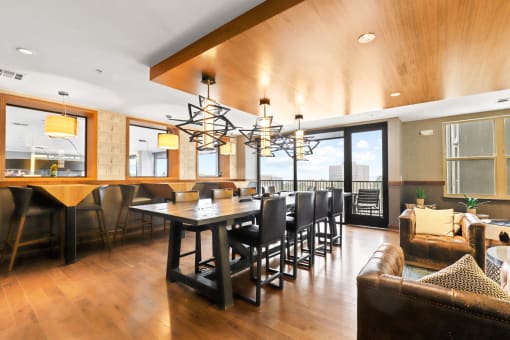 a large dining room with a large table and chairs
