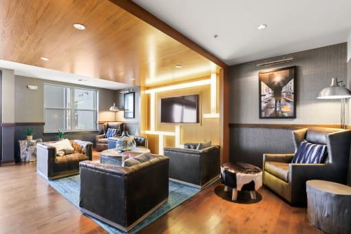 a living room filled with furniture and a flat screen tv