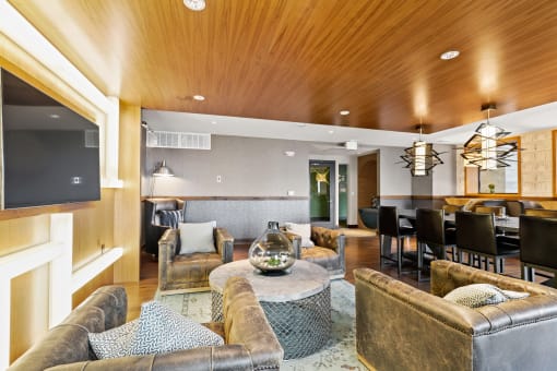 a living room filled with furniture and a flat screen tv