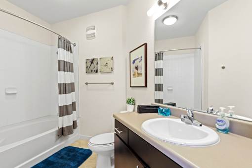 a bathroom with a toilet sink and bathtub