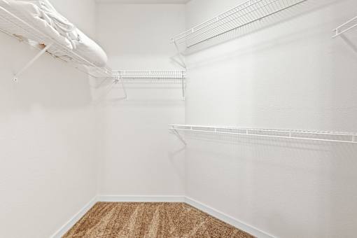 a walk in closet in a 555 waverly unit