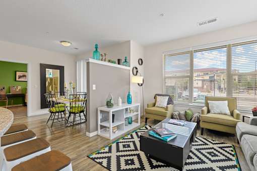 a living room with a couch chairs and a coffee table