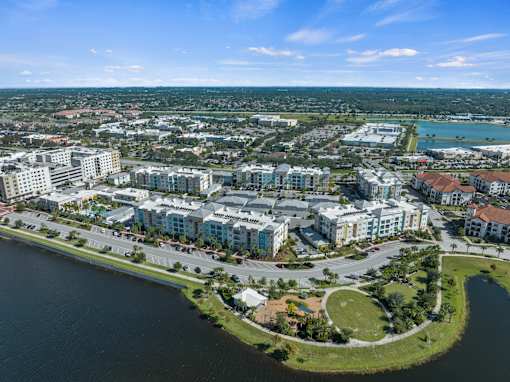 A bird's eye view of a residential area with a body of water in the foreground. at Centre Pointe Apartments, Melbourne, Florida